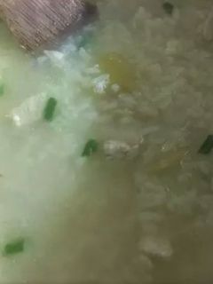 A picture of Arroz Caldo (Chicken Rice Porridge).