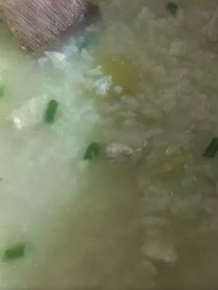 A picture of Arroz Caldo (Chicken Rice Porridge).