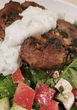 A picture of Greek Burgers w/yogurt sauce.