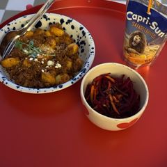 A picture of Gnocchi with Ground Beef and Beetroot Salad.
