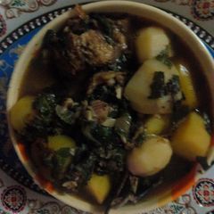 A picture of Catfish pepper soup with Irish potatoes.