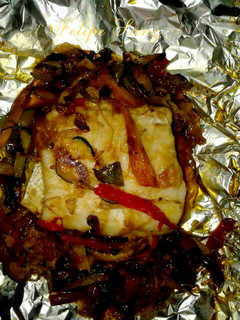 Una foto de Lomo de merluza en papillote