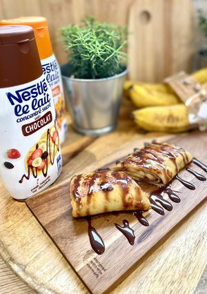 Une photo de Pâte à crêpes à la Banane (et crêpes fourrés à la banane, topping chocolat, flambée au Rhum blanc)