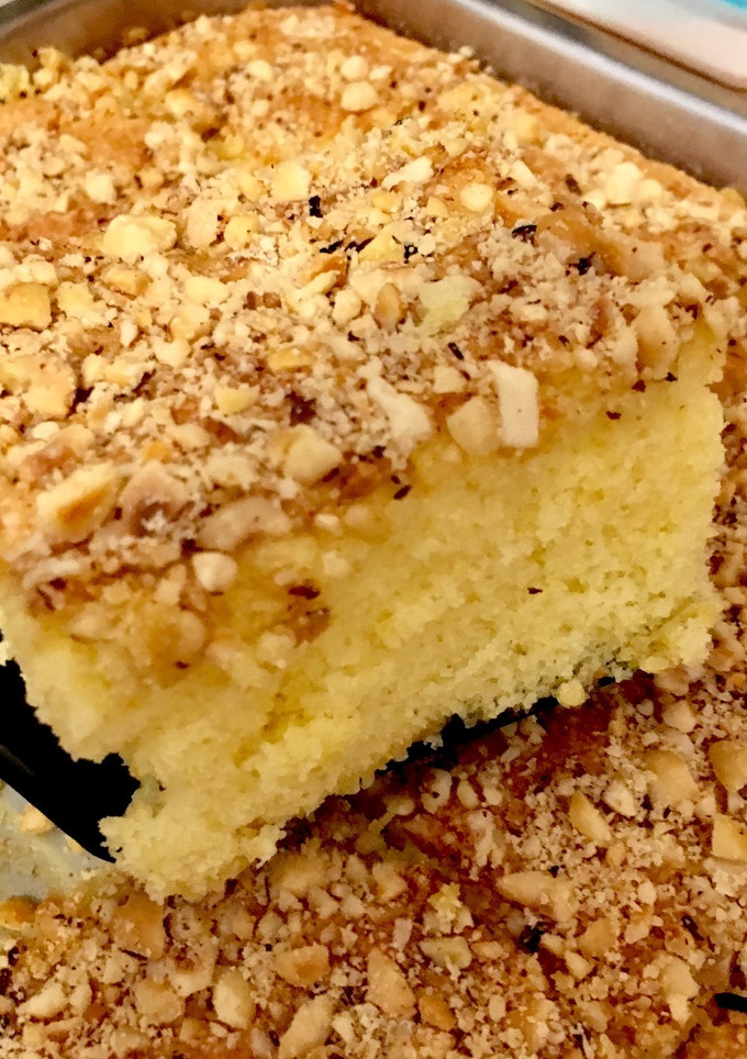 Una foto de Bizcocho de mandarina con cobertura de avellanas, almendras y cacahuetes 🍊🍰