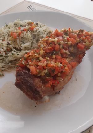 Una foto de Costillar a la Chilena con arroz Verde