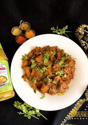 A picture of Echoré Kasundi (Raw Jackfruit Cooked in a Dum style with Mustard Sauce - Bong style).