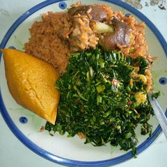 Jollof rice with vegetable sauce A picture of Jollof rice with vegetable sauce.
