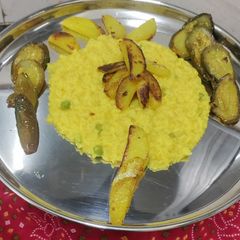 A picture of Bhoger Khichdi with Aloo Bhaja and Begun Bhaja.