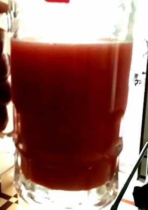 A picture of Pomegranate and orange juice.