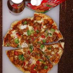 A picture of Spicy chicken tik'ka pizza.