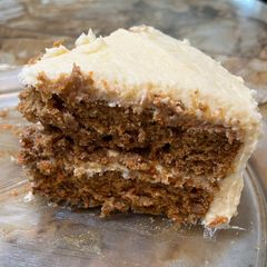A picture of Carrot cake with cream cheese frosting.