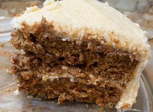 A picture of Carrot cake with cream cheese frosting.