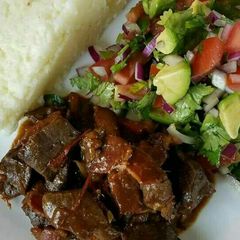 Wet fry beef Served with kachumbari A picture of Wet fry beef Served with kachumbari.