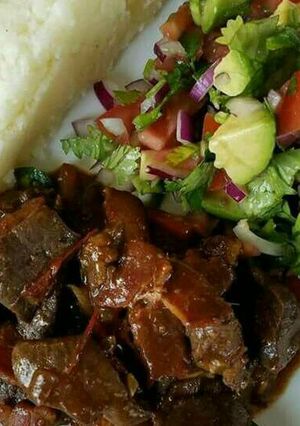 A picture of Wet fry beef Served with kachumbari.