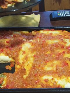 Una foto de Canelones de Acelga /panqueque y salsa