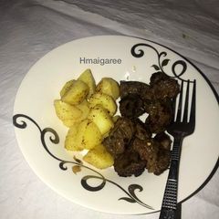 A picture of Pan grilled beef and garlic potatoes.