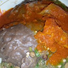 A picture of Amala and okro soup.