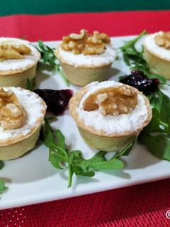 Una foto de Bocaditos de arándanos, queso y nueces