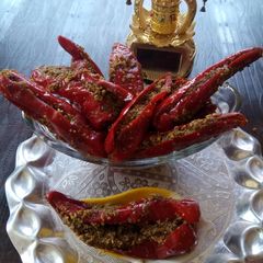 A picture of Stuffed red chilli pickle.