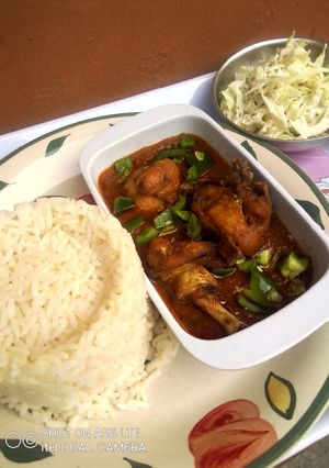 A picture of Orange rice, Chicken Stew and Creamy Cabbage Salad.