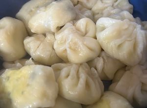 Una foto de Dumplings rellenos de queso y perejil