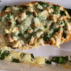 A picture of Chicken on a loaf.