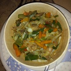 A picture of Vegetable sauce with chicken breast.