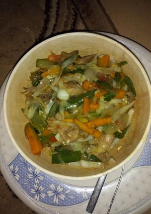 A picture of Vegetable sauce with chicken breast.