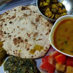 A picture of #cook pad india#jowar pulka roti,Dal,Kutra saag,kundru,pickle.