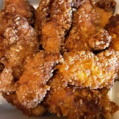 A picture of Pork rinds coated chicken fingers and shrimp.