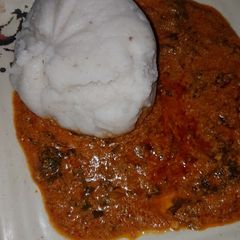 A picture of Tuwon rice with egusi soup 😋.