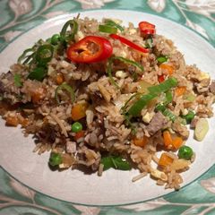A picture of Fried rice with leftover duck.
