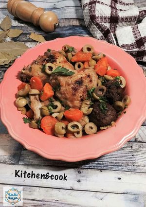 A picture of ​ Algerian Chicken Tagine with olives and meatballs.