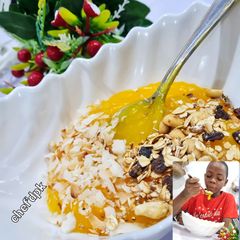 A picture of Custard with Granola,Coconut flakes.