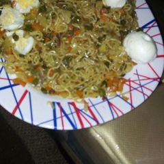 A picture of Noodles with vegies.