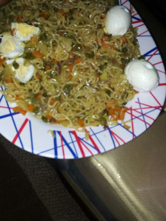 A picture of Noodles with vegies.
