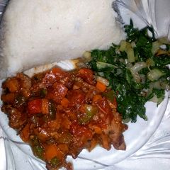 A picture of Steamed spinach and wet fried beef.