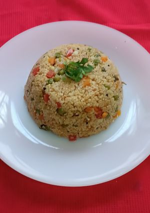 A picture of Broken Wheat Upma with Mixed Veggies.