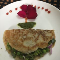 A picture of Peas stuffed oats cheela.