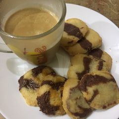 A picture of Coffee with chocolate biscuits by Mahi Ahsan Shah.