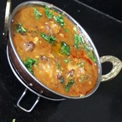 A picture of Kulthi dal and makai bati mix.