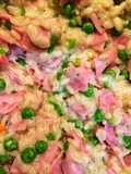 Risotto con prosciutto cotto, piselli e robiola