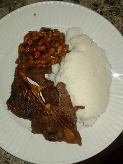 A picture of Wet Fried Beef, stewed beans with Ugali.
