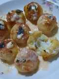 Ñoquis bolita rellenos con quesos y salsa de quesos