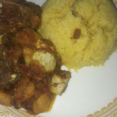 A picture of Tumeric Cuscuse with pateto and egg sup.