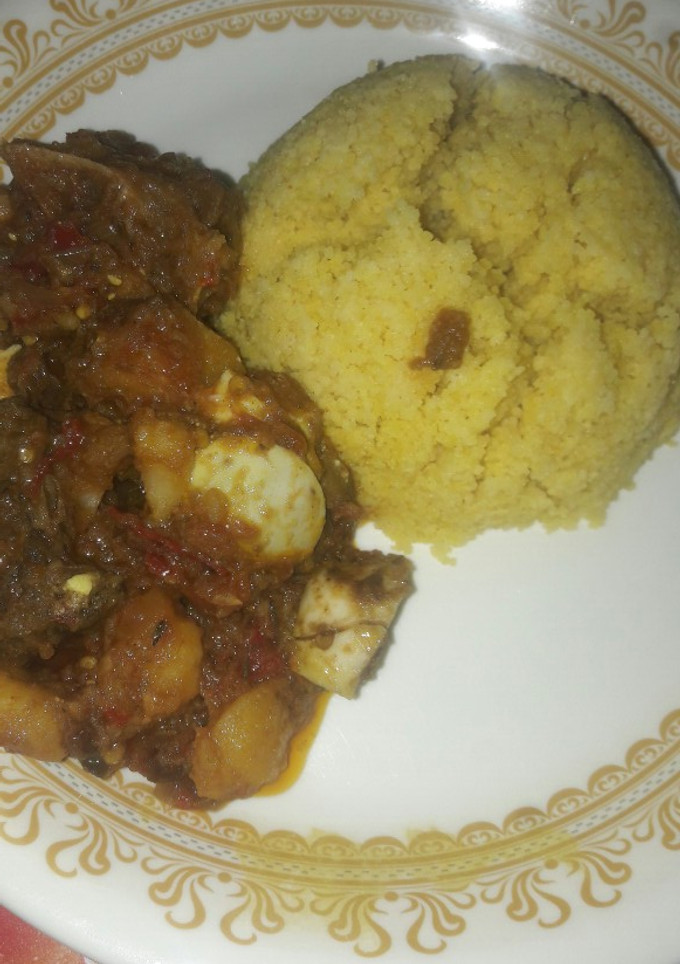 A picture of Tumeric Cuscuse with pateto and egg sup.