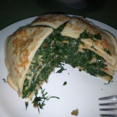 A picture of Sukumawiki Stuffed Pancakes.