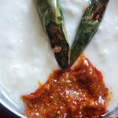 A picture of Green chili fry with curd.