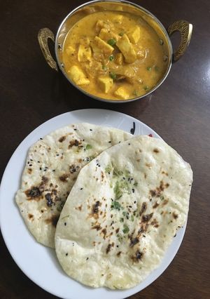 A picture of Plain butter Kulcha with Paneer Gravy.