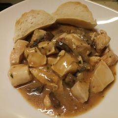 A picture of Chicken in a mushroom and tarragon sauce.